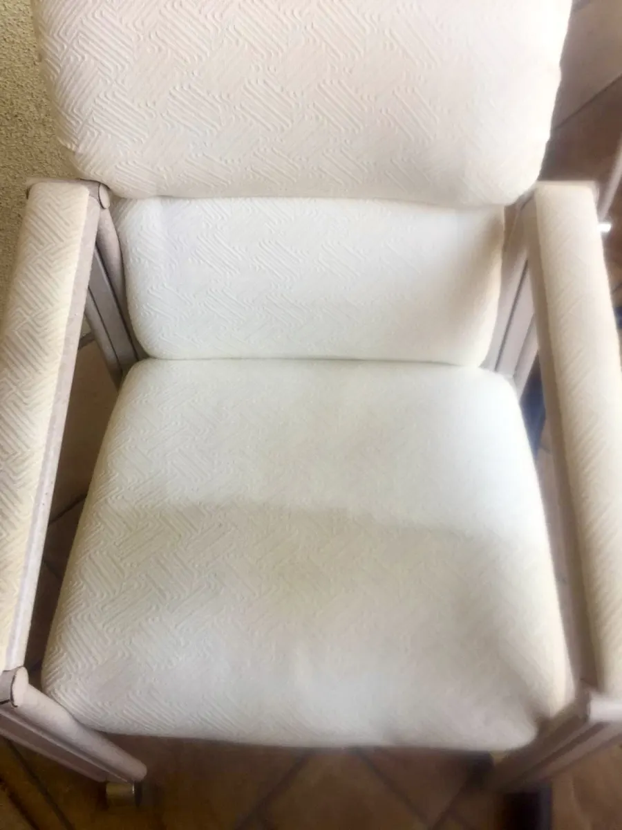 Ivory armchair with stains before upholstery cleaning