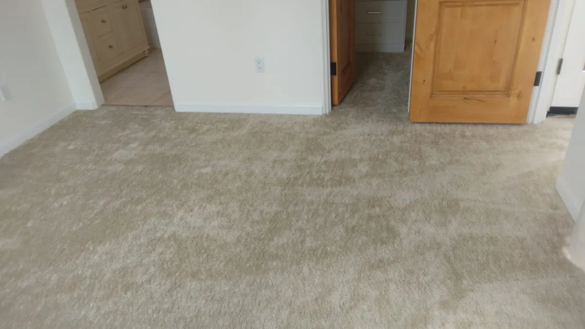Freshly cleaned white carpet in a bedroom