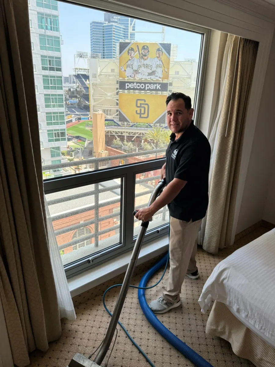 Technician cleaning hotel room carpet in downtown San Diego