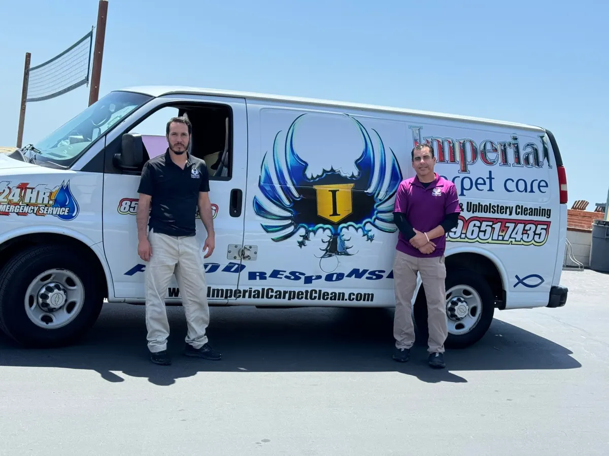 Two Imperial technicians standing by the flood response van